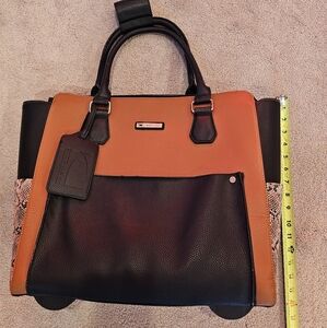 Brown and Black Roller Bag